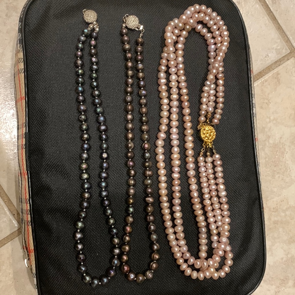 Three beautiful pearls necklaces.